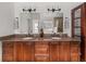 Bathroom with double vanity, granite countertop, and decorative mirrors at 121 Fulton Se Way, Atlanta, GA 30312