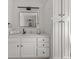 Contemporary bathroom featuring white cabinetry, a square mirror, and a stylish sink and countertop at 121 Fulton Se Way, Atlanta, GA 30312