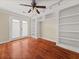 Bright bedroom features built-in bookshelves and french doors leading to patio at 121 Fulton Se Way, Atlanta, GA 30312
