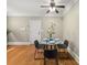 Light filled dining area with decorative art, wooden floors, and room for entertaining at 121 Fulton Se Way, Atlanta, GA 30312