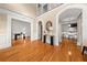 Spacious foyer showcasing hardwood floors, tall ceilings, elegant trim, and open access to other rooms at 121 Fulton Se Way, Atlanta, GA 30312