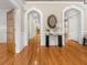 Elegant foyer with hardwood floors, arched doorways, and stylish console table at 121 Fulton Se Way, Atlanta, GA 30312