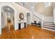 Elegant foyer boasts gleaming hardwood floors, a grand staircase, and stylish decor at 121 Fulton Se Way, Atlanta, GA 30312