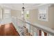 Bright hallway with wooden floors and white railing and natural light from exterior windows at 121 Fulton Se Way, Atlanta, GA 30312