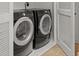 Laundry room area featuring a washer and dryer with shelving at 121 Fulton Se Way, Atlanta, GA 30312
