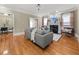 Cozy living room featuring hardwood floors, a fireplace, and a comfortable seating arrangement at 121 Fulton Se Way, Atlanta, GA 30312