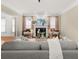 Living room featuring a decorative fireplace, large windows, and plush seating at 121 Fulton Se Way, Atlanta, GA 30312
