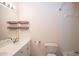 Bathroom features a double sink vanity, toilet, and shower over tub at 1215 Harris Commons Pl, Roswell, GA 30076