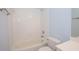 Bathroom featuring a shower over tub, white toilet and light blue walls at 1215 Harris Commons Pl, Roswell, GA 30076