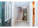 Inviting entryway with tiled floor and a staircase leading to the upper level at 1215 Harris Commons Pl, Roswell, GA 30076