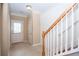 Entryway featuring tiled floor, stairs with white risers, and access to the backyard at 1215 Harris Commons Pl, Roswell, GA 30076