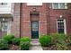 Charming brick townhome with well-manicured landscaping and a cozy entrance at 1215 Harris Commons Pl, Roswell, GA 30076