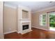 Living room fireplace with decorative mantel and tile surround provides a cozy focal point at 1215 Harris Commons Pl, Roswell, GA 30076