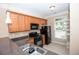 Kitchen featuring stainless steel appliances, granite countertops and sleek, modern design at 1215 Harris Commons Pl, Roswell, GA 30076
