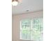 Window with white blinds allowing natural light to filter into the room at 1215 Harris Commons Pl, Roswell, GA 30076