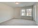 Cozy bedroom with carpet and double windows offering ample natural light at 349 Heavenly Hollow Pl, Mcdonough, GA 30253