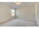 Light-filled bedroom with carpeting, large windows, and neutral wall color at 349 Heavenly Hollow Pl, Mcdonough, GA 30253