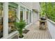 Outdoor deck featuring a grill, plants, and a tranquil setting, perfect for outdoor cooking and entertaining at 443 Lakeshore Ne Dr, Atlanta, GA 30307