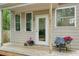 Inviting back porch with a decorative chair and flowers, perfect for relaxation at 443 Lakeshore Ne Dr, Atlanta, GA 30307