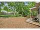 A serene backyard with a charming deck and lush greenery at 443 Lakeshore Ne Dr, Atlanta, GA 30307