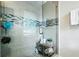 Bathroom shower featuring decorative tile accent border and sleek glass door at 443 Lakeshore Ne Dr, Atlanta, GA 30307