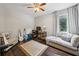 Relaxing room featuring a guitar, a large window, and comfortable seating at 443 Lakeshore Ne Dr, Atlanta, GA 30307