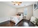Bright bedroom showcasing a hardwood floor, a window, and simple, elegant decor at 443 Lakeshore Ne Dr, Atlanta, GA 30307
