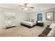 Cozy bedroom featuring a ceiling fan, an accent chair, and stylish decor at 443 Lakeshore Ne Dr, Atlanta, GA 30307