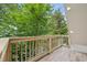 Large deck surrounded by lush trees provides ultimate privacy at 443 Lakeshore Ne Dr, Atlanta, GA 30307