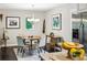 Cozy dining area featuring a round table, modern chandelier, stainless steel refrigerator and natural light at 443 Lakeshore Ne Dr, Atlanta, GA 30307