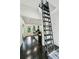 Hallway featuring dark wood floors and a ladder to the attic by the office at 443 Lakeshore Ne Dr, Atlanta, GA 30307
