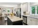 Bright kitchen with granite countertops, stainless steel appliances, and a view to the adjacent dining area at 443 Lakeshore Ne Dr, Atlanta, GA 30307