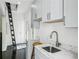 Well-equipped laundry room featuring a marble countertop, a stool and ladder to the attic at 443 Lakeshore Ne Dr, Atlanta, GA 30307