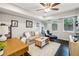 Cozy living room with plush seating, hardwood floors, a ceiling fan, and bright natural light at 443 Lakeshore Ne Dr, Atlanta, GA 30307
