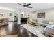 Open-concept living space featuring hardwood floors, ample seating, and easy access to the dining and kitchen areas at 443 Lakeshore Ne Dr, Atlanta, GA 30307