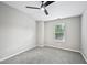 Neutral bedroom featuring carpet flooring, ceiling fan, and white trim and doors at 503 Mill Ridge Rd, Woodstock, GA 30188
