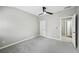 Neutral bedroom featuring carpet flooring, ceiling fan, and white trim and doors at 503 Mill Ridge Rd, Woodstock, GA 30188