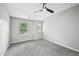 Neutral bedroom featuring carpet flooring, ceiling fan, and white trim and doors at 503 Mill Ridge Rd, Woodstock, GA 30188