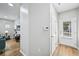 Inviting entryway with light hardwood floors, leading to a brightly lit living area at 503 Mill Ridge Rd, Woodstock, GA 30188