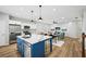 Spacious kitchen with stainless steel appliances, large center island, and open layout at 503 Mill Ridge Rd, Woodstock, GA 30188