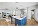Bright kitchen with stainless steel appliances, a large center island and hardwood floors at 503 Mill Ridge Rd, Woodstock, GA 30188