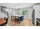 Well-lit kitchen with island seating and stainless steel appliances at 503 Mill Ridge Rd, Woodstock, GA 30188