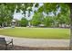 Serene community park featuring lush green space, mature trees, and a walking path for residents to enjoy at 503 Mill Ridge Rd, Woodstock, GA 30188