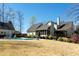 A view of the backyard with a swimming pool and home exterior at 109 Lighthorse Blvd, Mcdonough, GA 30252