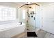 Bright bathroom with a soaking tub and a glass-enclosed shower at 109 Lighthorse Blvd, Mcdonough, GA 30252