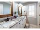 Bathroom with dual sinks, granite countertops, and white cabinets at 109 Lighthorse Blvd, Mcdonough, GA 30252