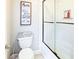 Bathroom featuring subway tile, and shower with glass door at 109 Lighthorse Blvd, Mcdonough, GA 30252