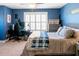 Comfortable bedroom features a desk and a large window for plenty of natural light at 109 Lighthorse Blvd, Mcdonough, GA 30252