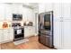 Contemporary kitchen featuring stainless steel appliances and plenty of storage space at 109 Lighthorse Blvd, Mcdonough, GA 30252