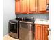 Convenient laundry room with modern washer, dryer, and built-in sink at 109 Lighthorse Blvd, Mcdonough, GA 30252